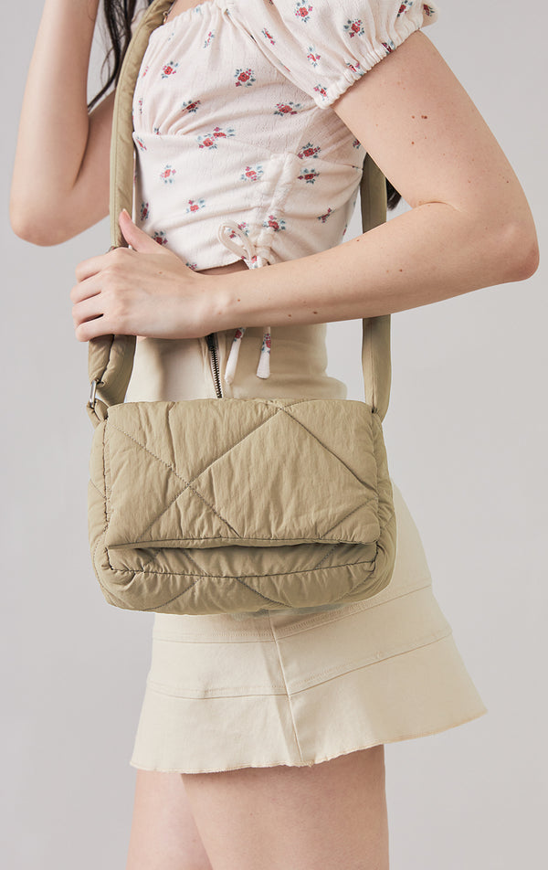 Khaki 2-in-1 Sling with Pouch Puffer Bag worn by a model to see it in motion