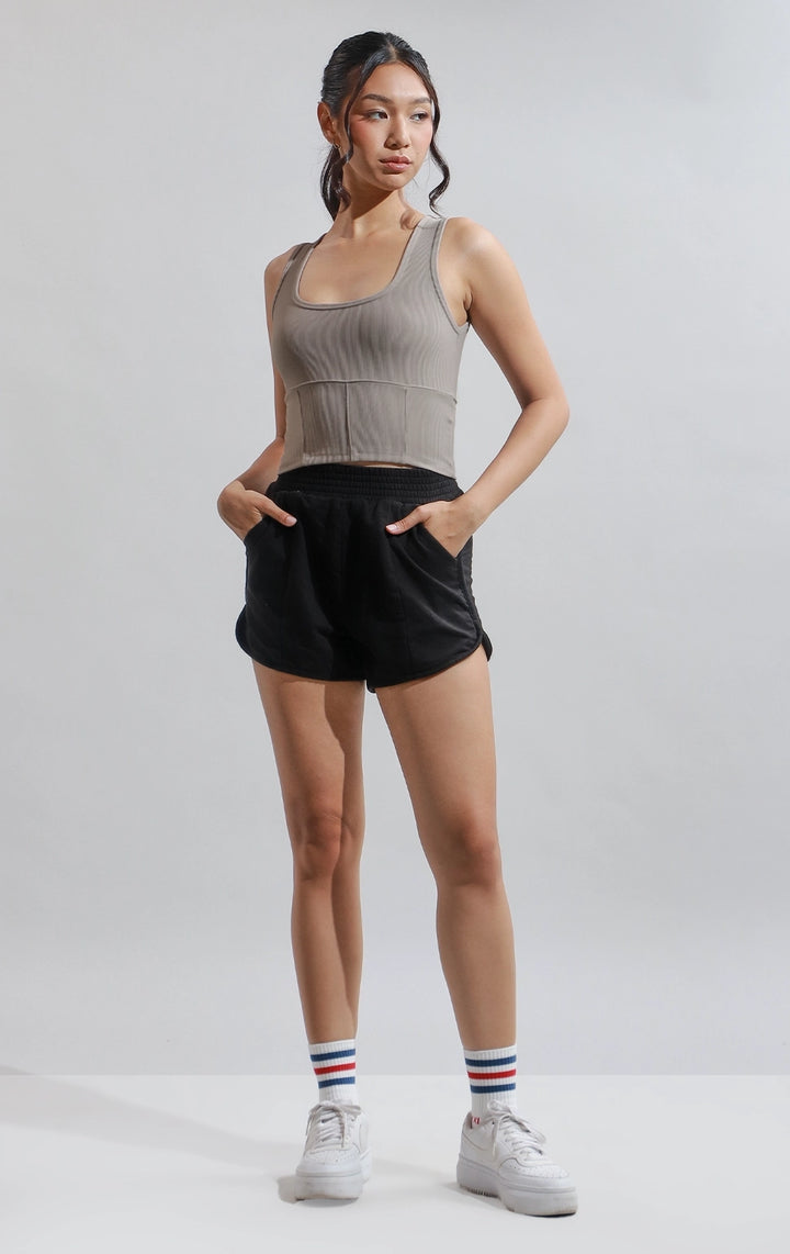 Full front view of woman in brown Ribbed Corsetry-Like Square Neck Tank Top, showing the structured corset-inspired seams and ribbed fabric. From Just G Philippines.
