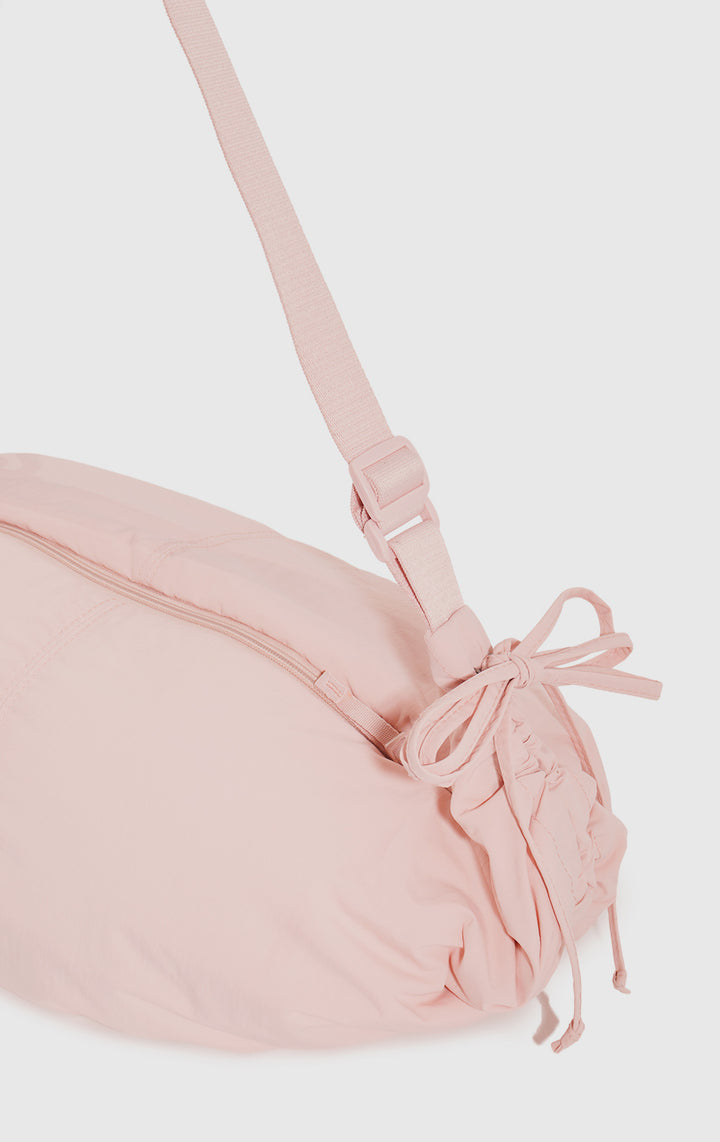 Close-up of the drawstring and texture on the Pink Dumpling Shoulder Bag