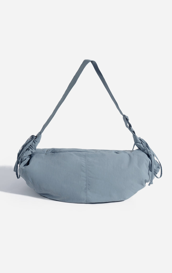 Front view of the Blue Dumpling Shoulder Bag with Drawstring Details for Women