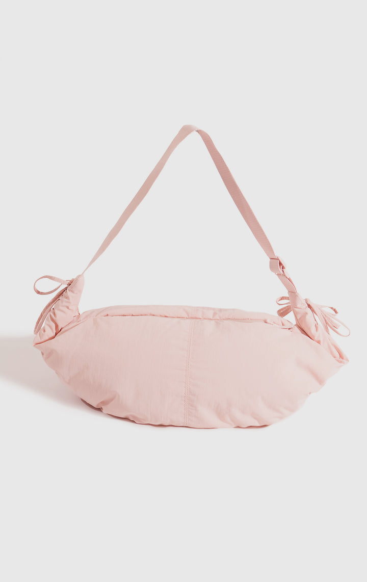 Front view of the Pink Dumpling Shoulder Bag with Drawstring Details for Women