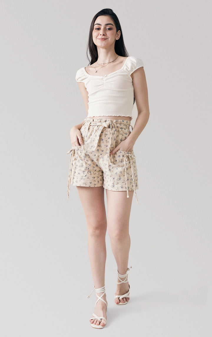 Full front view of the Textured Ribbed Jersey Corset-Like Top with Picoting and Bow in offwhite, showcasing its structured corset-inspired seams and puff sleeves from Just G Philippines.