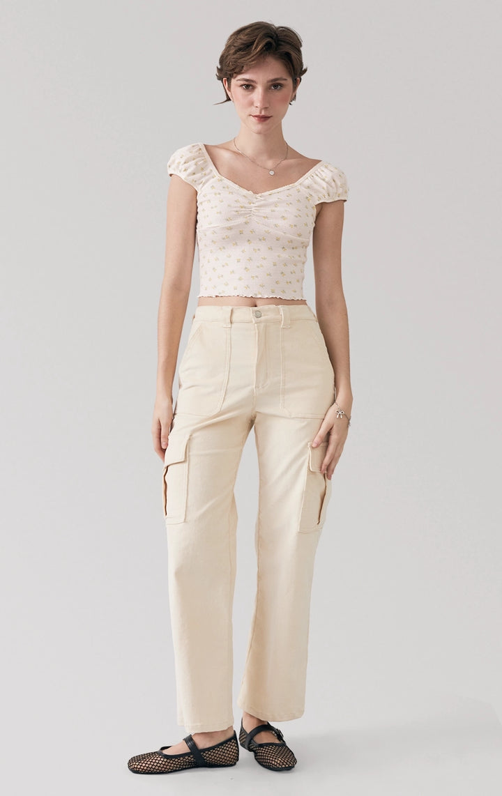 Full front view of the Printed Textured Ribbed Jersey Corset-Like Top, highlighting the puff sleeves, corset-like seams, and delicate bow detail from Just G Philippines.