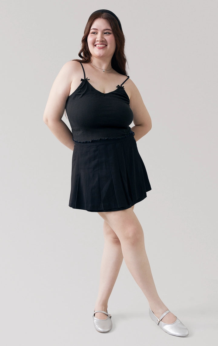 Full front view of the Pointelle Ribbed Jersey Tank Top in black, featuring lace trim, bow accents, and cropped silhouette from Just G Philippines.