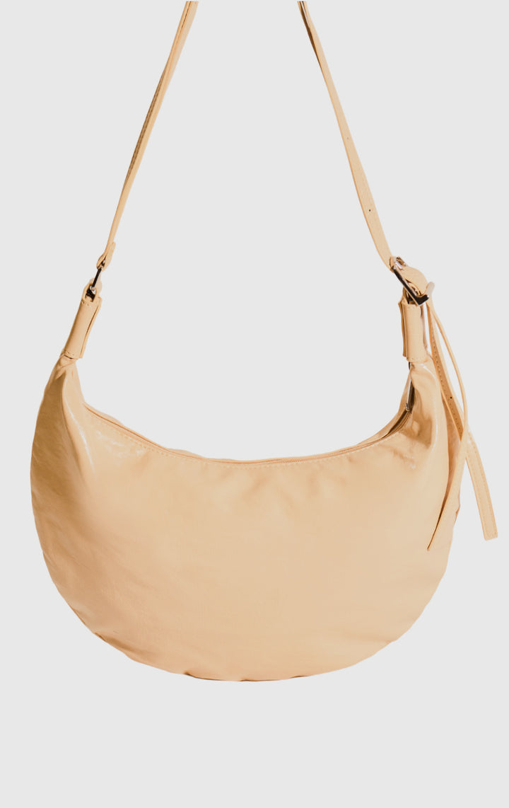 Close-up of the material and handle on the Yellow Faux Leather Dumpling Shoulder Bag