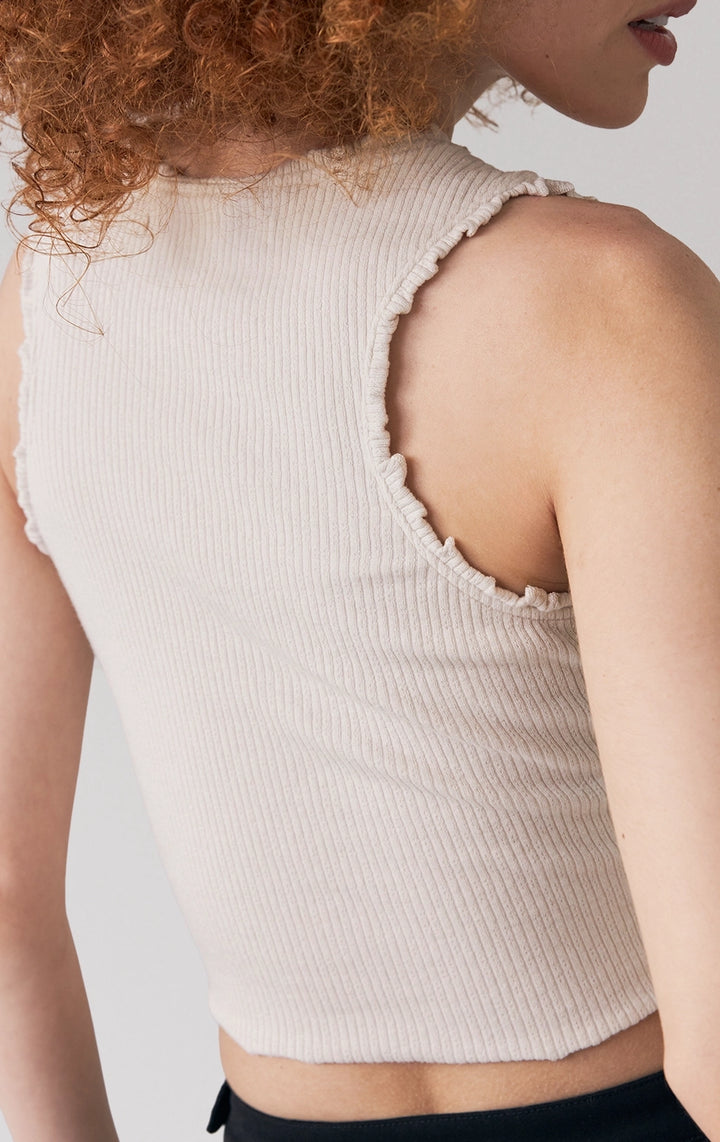 Close-up of back details of the Pointelle Jersey Ruched Tank Top in offwhite, showing pointelle knit fabric and seamless finish from Just G Philippines.