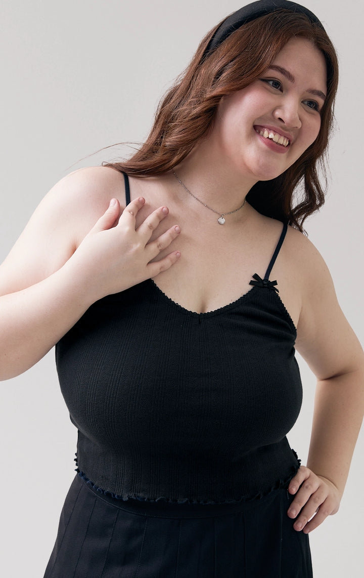 Stylized photo of model in the Pointelle Ribbed Jersey Tank Top in black, styled for casual dates from Just G Philippines’ Back to School collection.