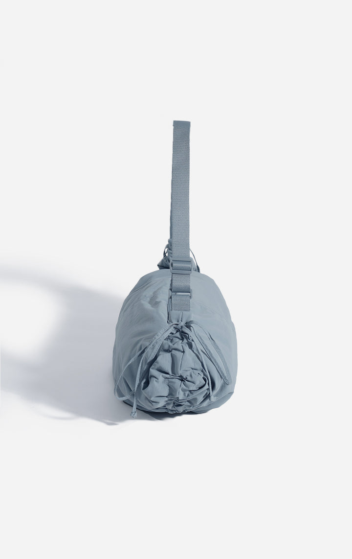 Back view of the Blue Dumpling Shoulder Bag with Drawstring Details for Women