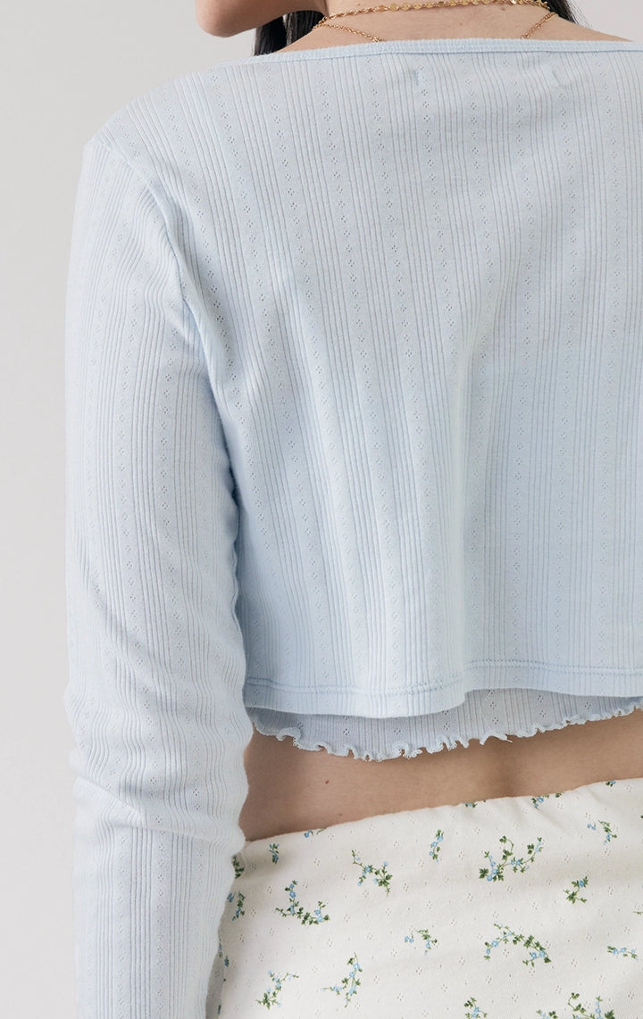 Close-up of the back details of the Pointelle Ribbed Jersey Long Sleeve Cropped Cardigan in blue from Just G Philippines, showing soft pointelle texture and light stretch.