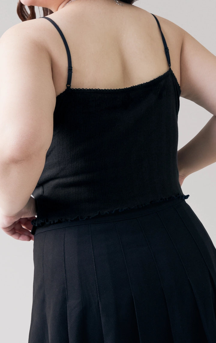 Close-up of back details of the Pointelle Ribbed Jersey Tank Top in black, featuring the ribbed knit texture and slim back straps from Just G Philippines.