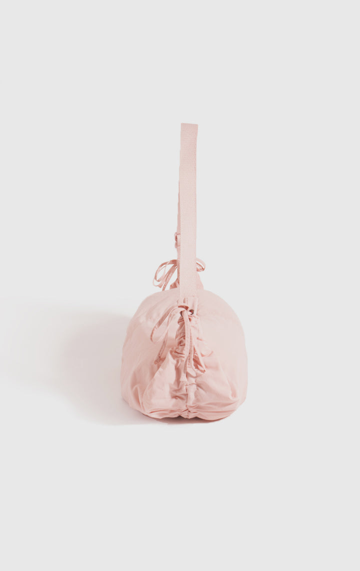 Back view of the Pink Dumpling Shoulder Bag with Drawstring Details for Women