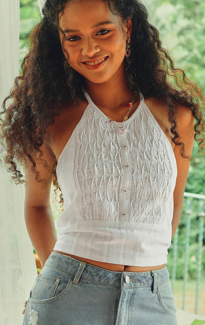 Campaign photo of the textured dobby diamond smocking tuxedo-like halter top that shows how it looks when worn, from the Just G Love In Bloom collection