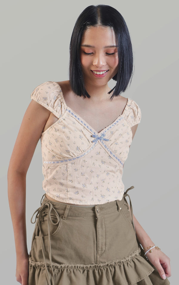 Front close-up of the rustic floral top with lace and ribbon dobby fabric, delicate ruffles, and smocking by Just G Philippines