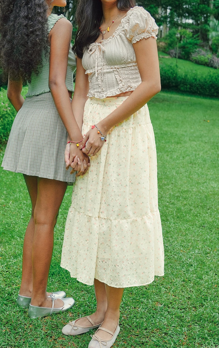 Campaign photo of the high waist floral embroidered tiered midi peasant skirt that shows how it looks when worn, from the Just G Love In Bloom collection