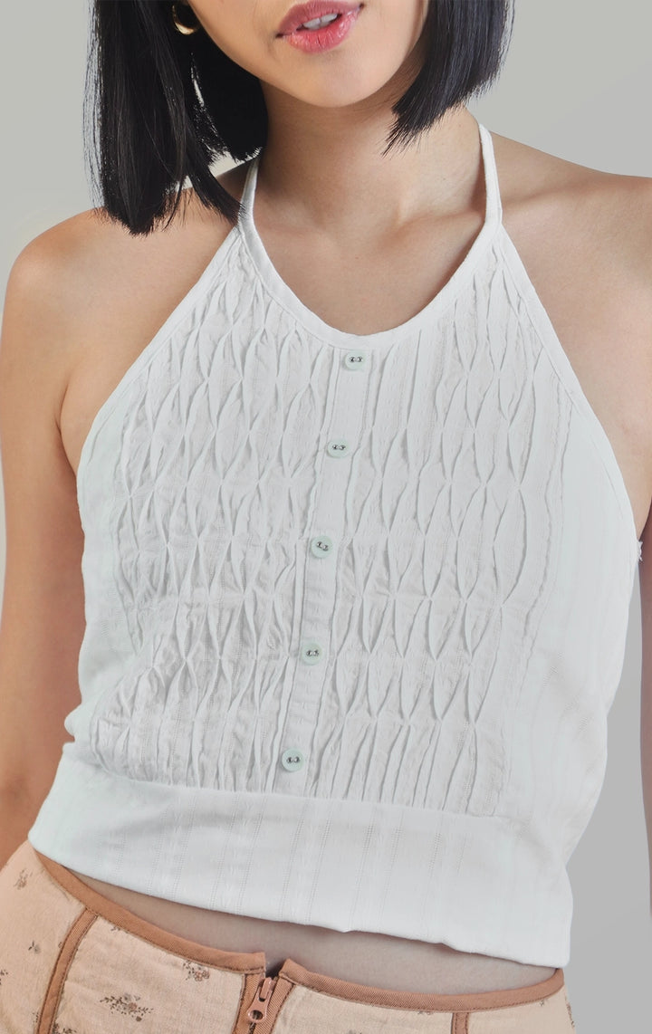 Front close-up of the dobby diamond smocking tuxedo-like halter top highlighting the dobby texture, smocking pattern, and structured panel by Just G Philippines