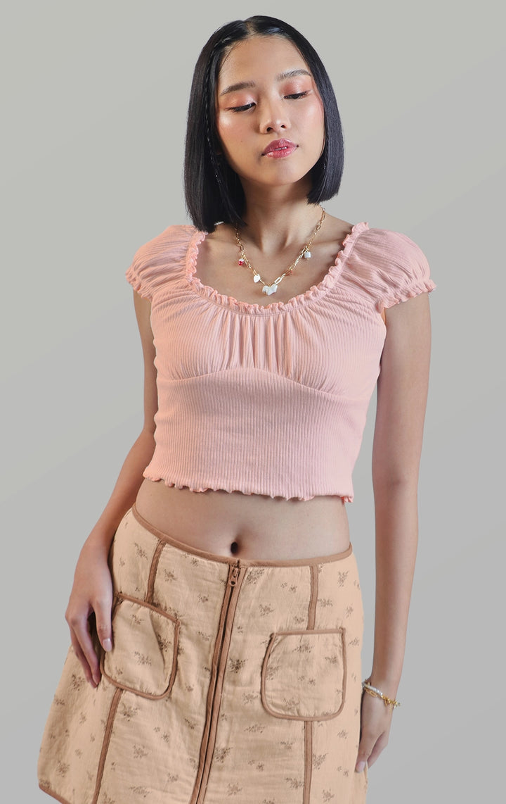 Front detail close-up of the pointelle jersey ruffled milkmaid puff sleeve top focusing on the ruffled neckline and puff sleeve seams by Just G Philippines