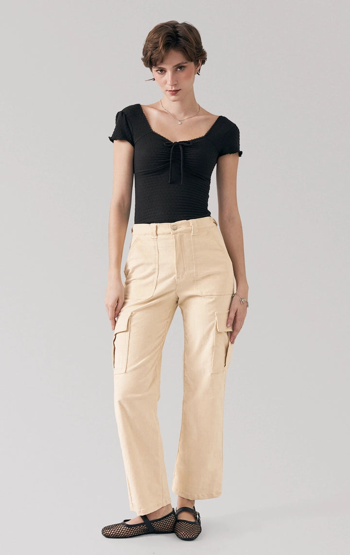 Full front view of a model wearing the ruched textured jersey bodysuit with sweetheart neckline by Just G Philippines
