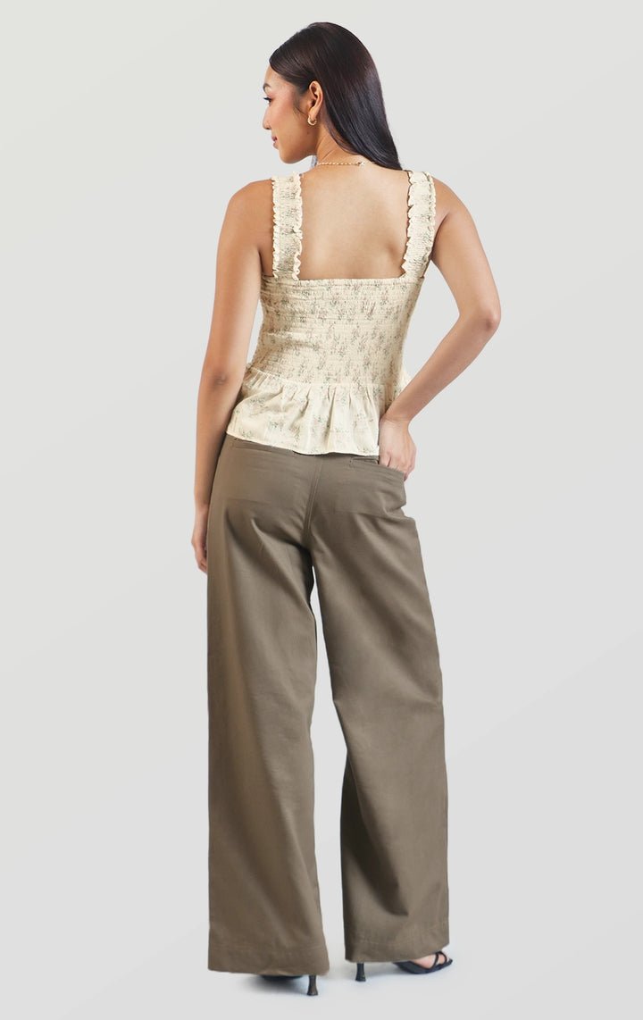 Full back view of the floral smocked peplum top featuring a smocked panel and peplum hem by Just G Philippines