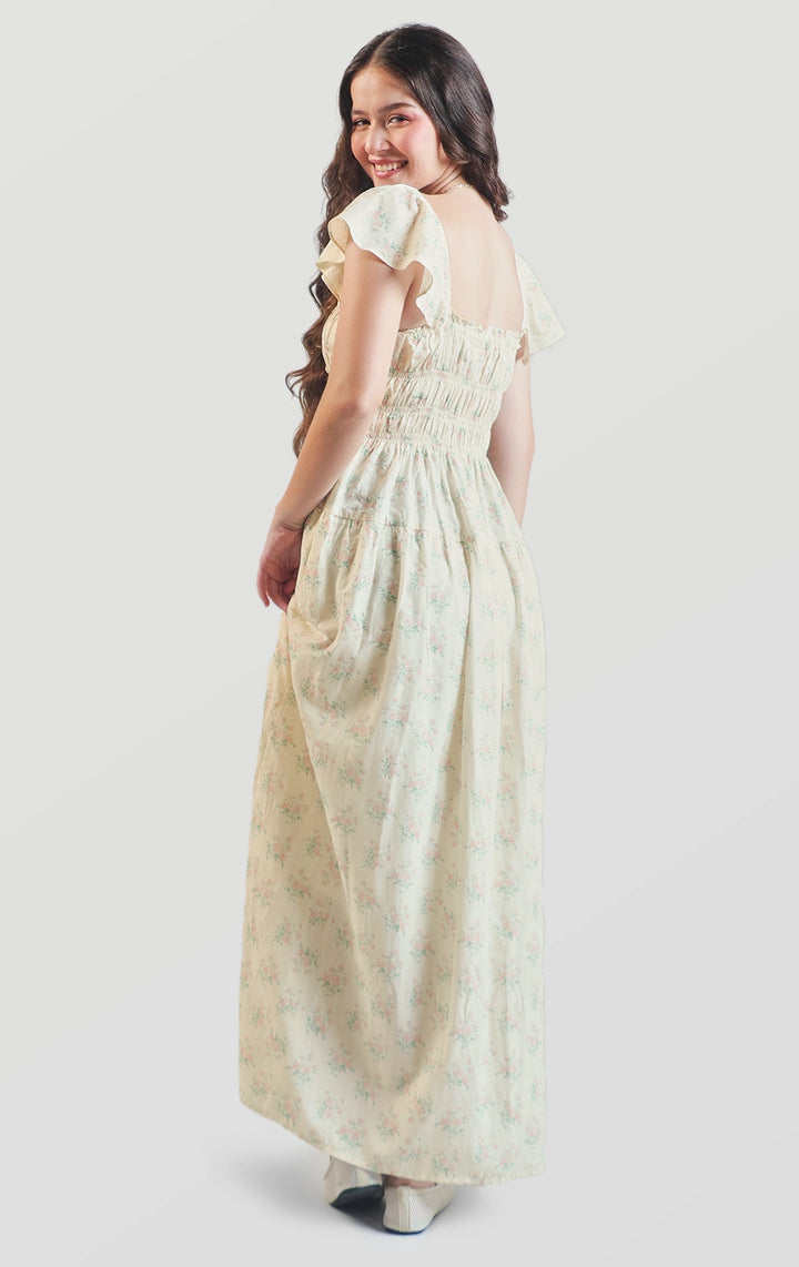Full back view of the floral smocked maxi dress with flutter sleeves and smocked bodice by Just G Philippines