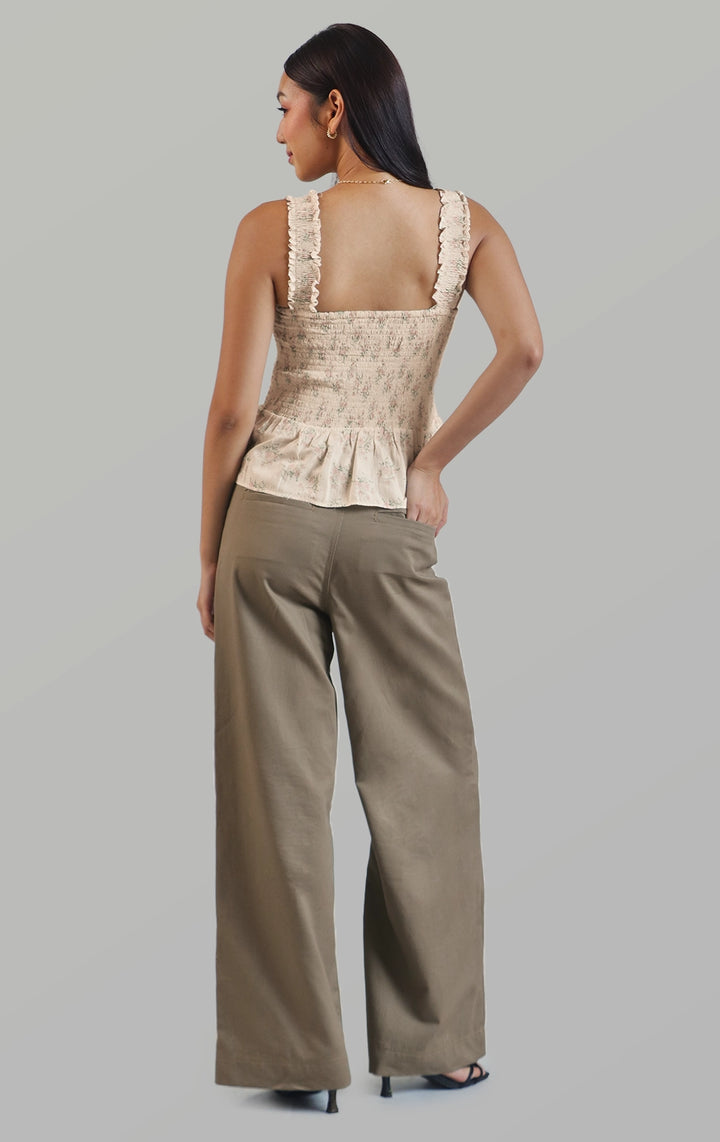 Full back view of the twill highwaisted wide leg pants highlighting the cut and sew design and back pockets by Just G Philippines