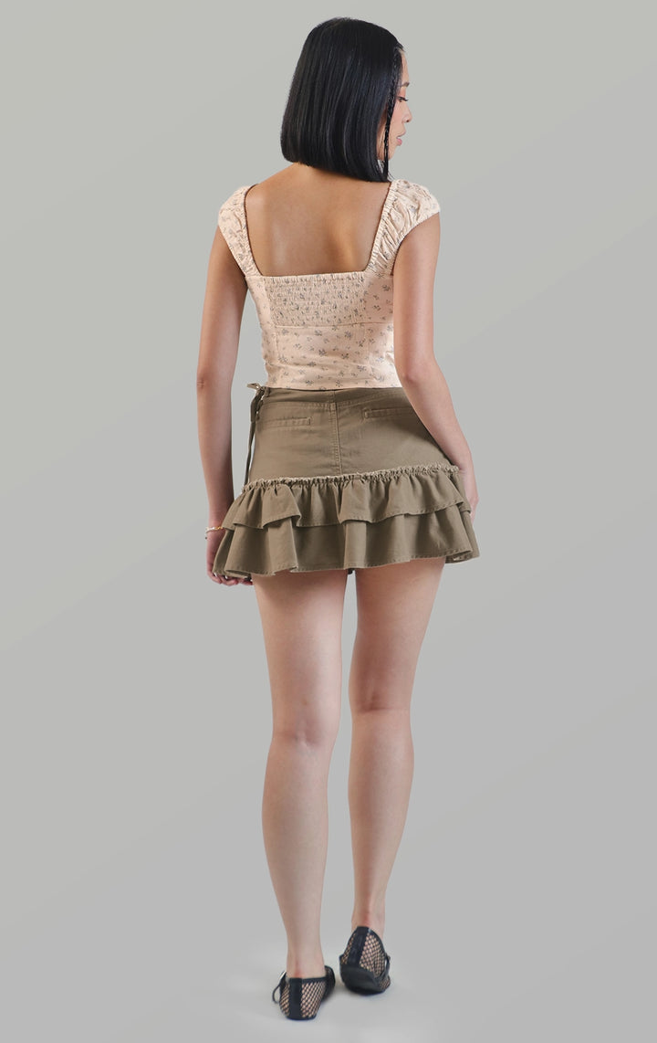 Full back view of the mid waist frilly mini skort with lace up side detail showing the layered tiers by Just G Philippines