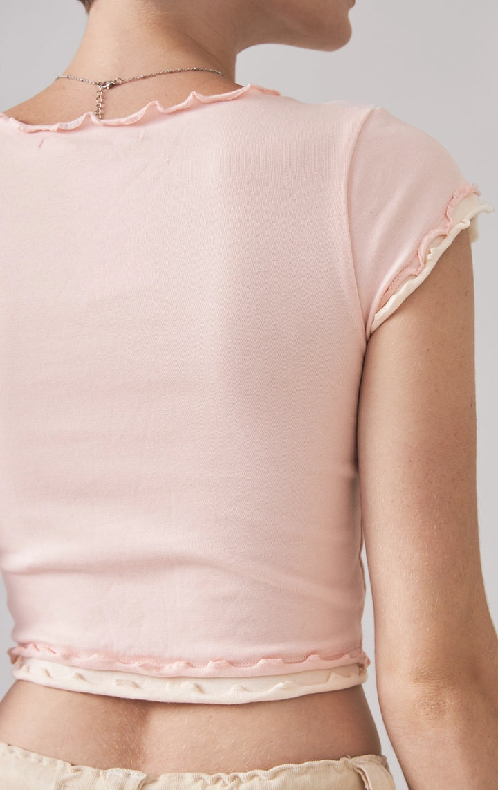 Back detail close-up of the ribbed fabric and stitching on the back hem of the pink 90s tee by Just G Philippines