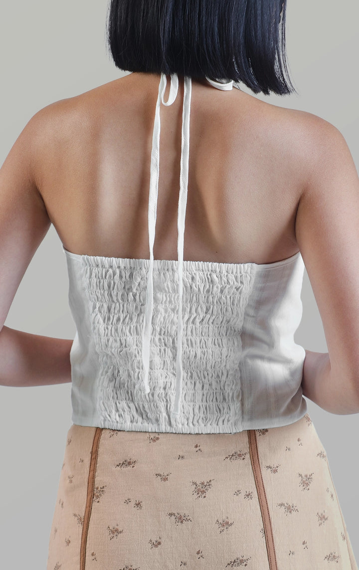 Back close-up of the textured dobby diamond smocking tuxedo-like top showing the halter tie and open back design by Just G Philippines
