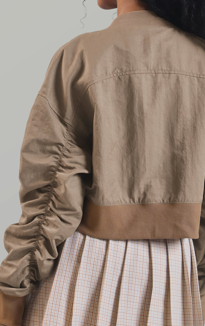 Back detail close-up of the polynylon cropped bomber jacket showing the back ruching detail and cropped hem for women by Just G Philippines