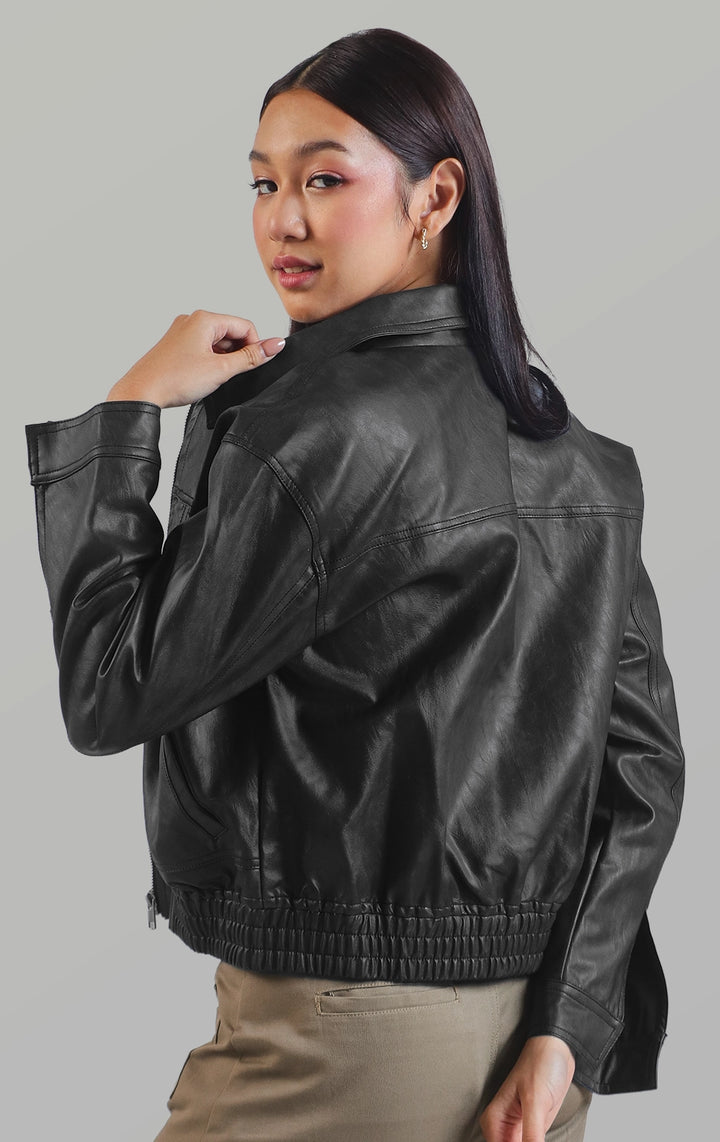 Back detail close-up of the nylon/leather boyfriend jacket for women highlighting the panel stitching and smooth leather material by Just G Philippines
