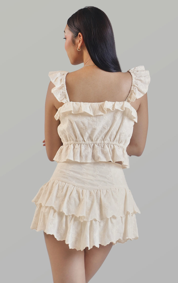 Back detail close-up of the ruffle sleeves, tiered skort, and embroidered details by Just G Philippines