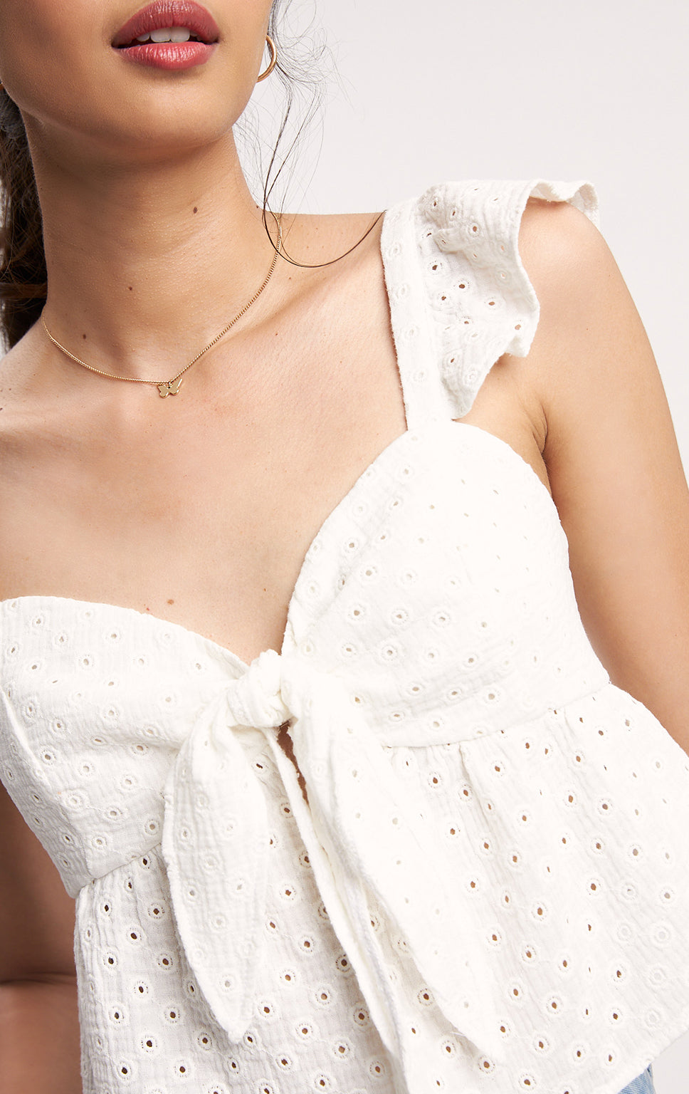 ROMANTIC EYELET KNOTTED TOP WITH RUFFLES