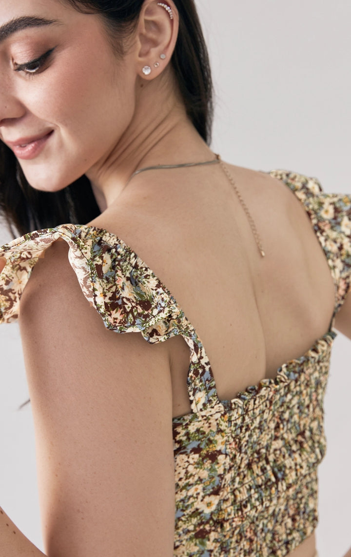 Back detail close-up of the smocked panel and polyester texture of the floral bustier top by Just G Philippines