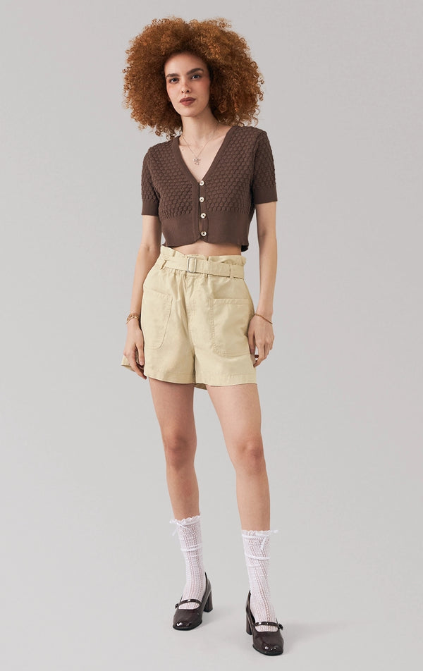 Full front view of a model wearing the pointelle knit button front crop top with v-neckline by Just G Philippines