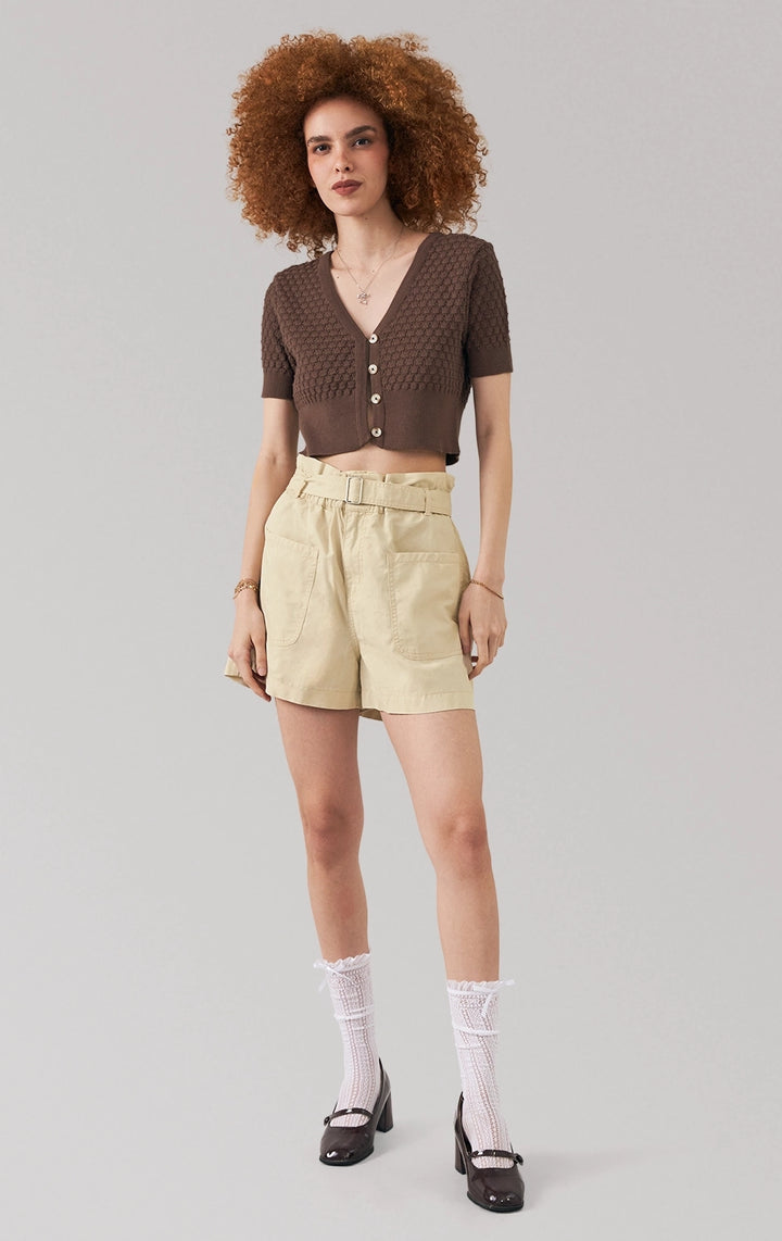 Full front view of a model wearing the pointelle knit button front crop top with v-neckline by Just G Philippines