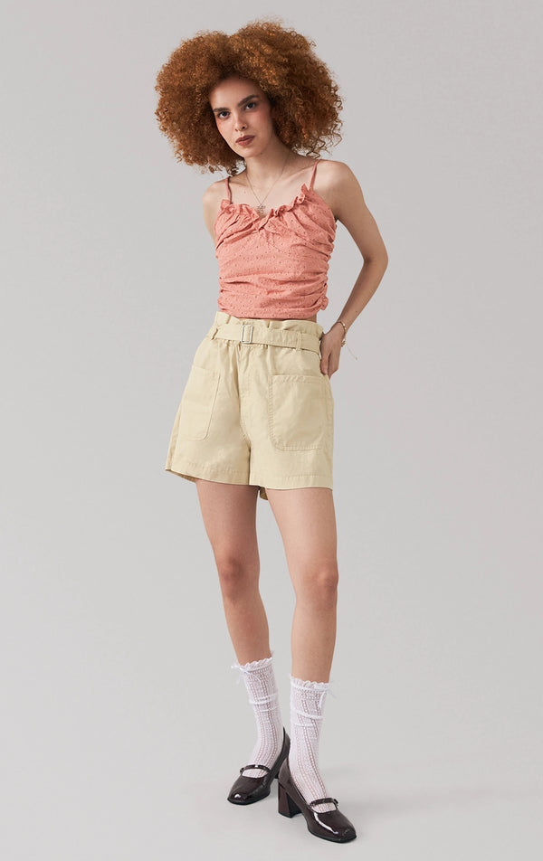 Full front view of a model wearing the eyelet draped top with v-neckline, ruffles, and cropped fit by Just G Philippines