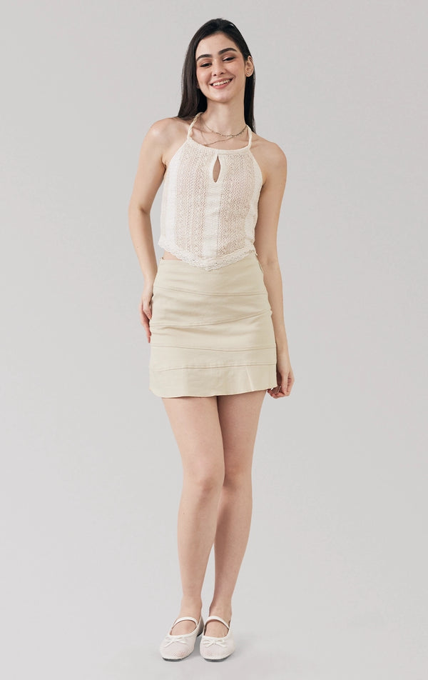Full front view of the offwhite Crochet-Like Halter Top with Handkerchief Hem, showing halter neckline and crochet texture, from Just G Philippines’ Back to School collection.