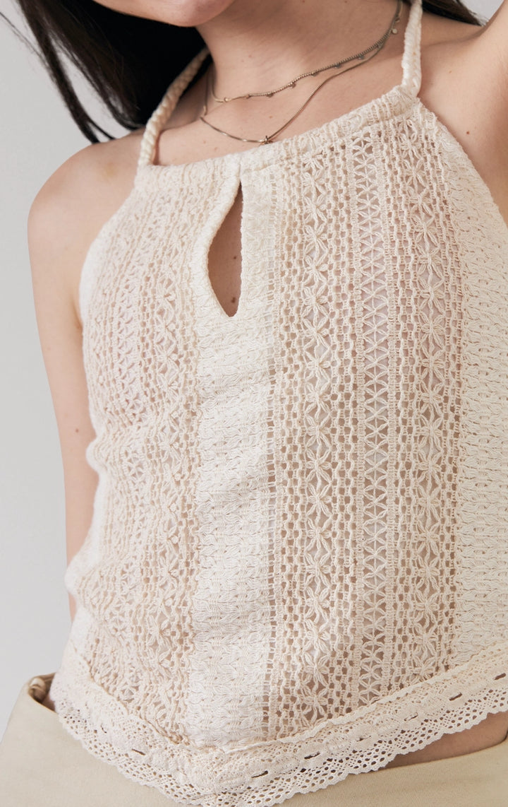 Close-up of front details of the offwhite Crochet-Like Halter Top with Handkerchief Hem, highlighting the intricate crochet-like design and neckline from Just G Philippines.