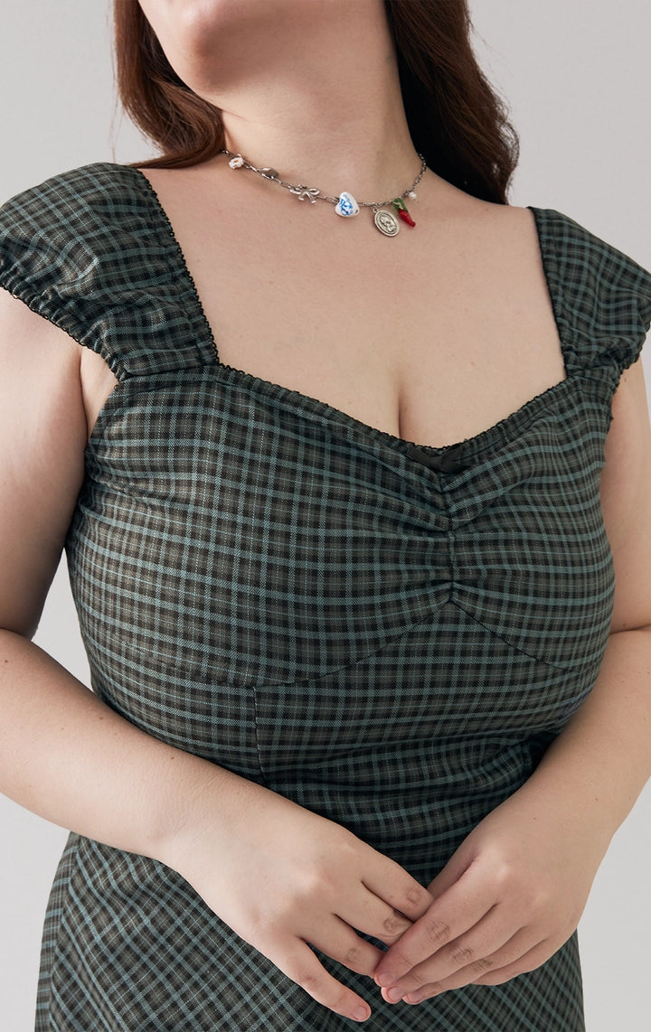Front detail close-up of the bustier seam, checkered fabric, and sweetheart neckline on the dress by Just G Philippines