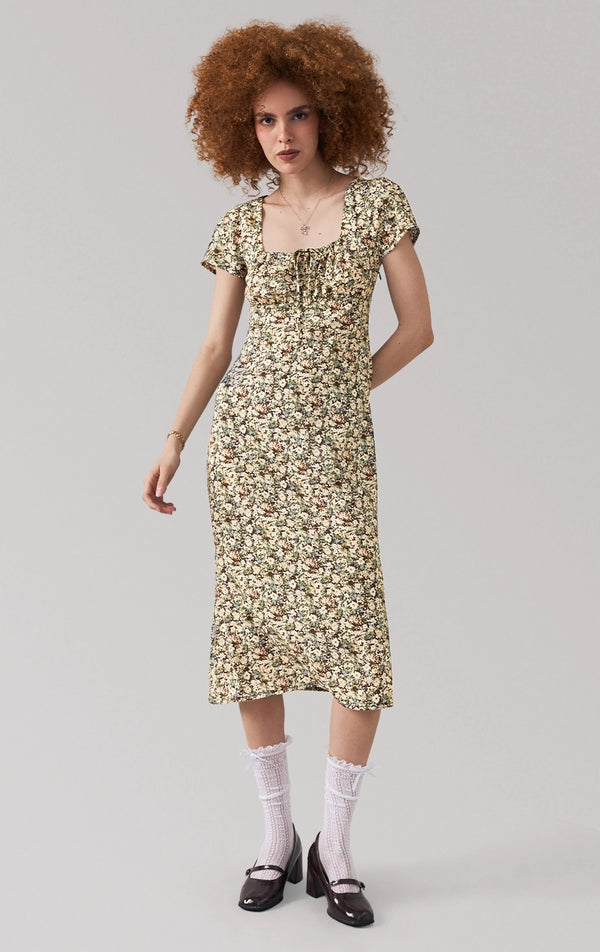 Full front view of a model wearing the multicolor floral midi dress with short sleeves and square neckline by Just G Philippines