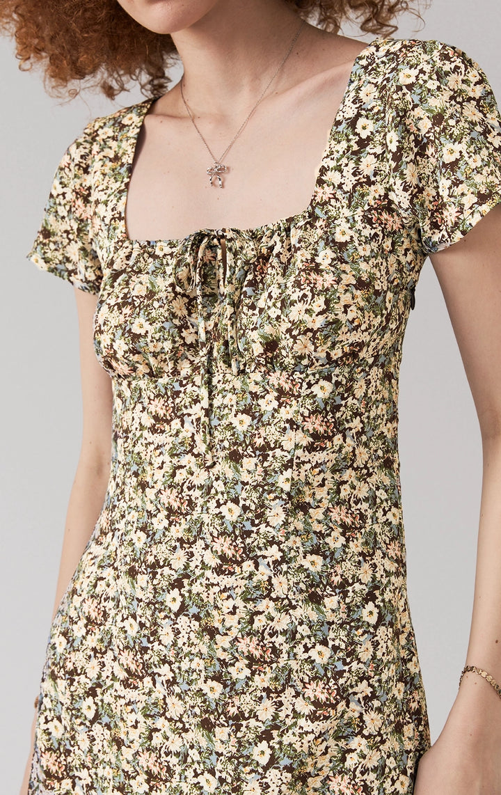 Front detail close-up of the floral fabric and tie detail on square neckline of midi dress by Just G Philippines