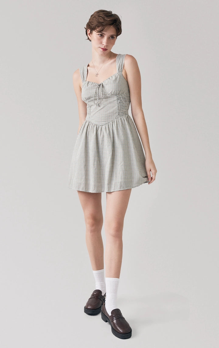 Full front view of woman in Checkered Corset-Like Dress with Smocking, showing sweetheart neckline, strappy sleeves, and corset seams. From Just G Philippines.