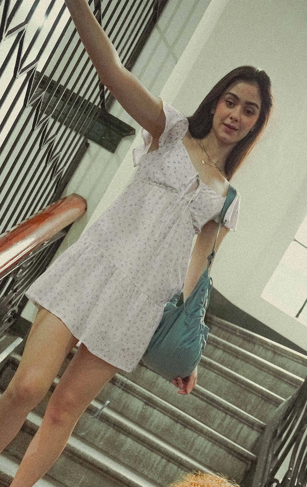 Campaign photo of woman wearing Floral Print Flowy Tiered Short Dress from the back to school collection of Gen Z women's brand Just G Philippines.
