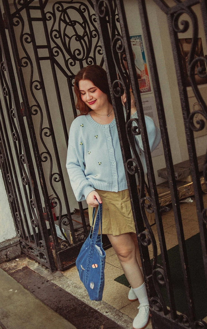 Campaign photo of woman wearing Chunky Knit Cardigan With Flower Bullion Embroidery in blue from Gen Z and young adult women's brand Just G Philippines.