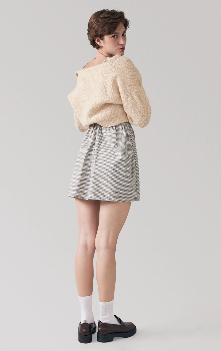 Full back view of beige Boucle Knit Loose Button Front Cardigan, highlighting the textured boucle knit and relaxed cut from the Back to School collection by Just G Philippines.