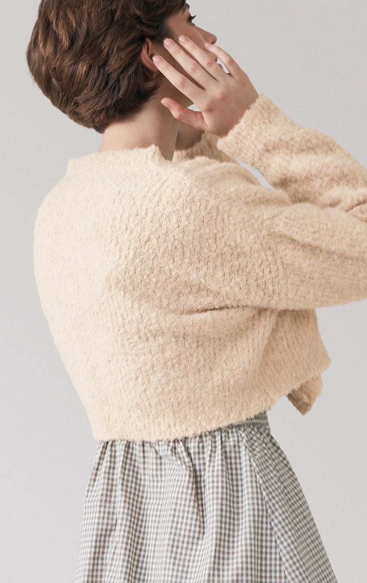 Close-up of back detail on beige Boucle Knit Loose Button Front Cardigan, featuring the boucle fabric and softly draped silhouette from Just G Philippines.