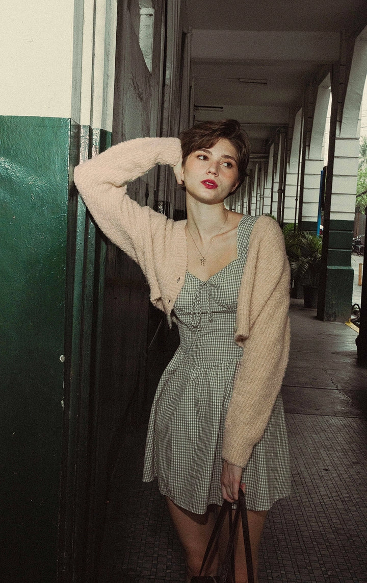 Campaign photo of woman wearing Boucle Knit Loose Button Front Cardigan in beige from Gen Z and young adult women's brand Just G Philippines.