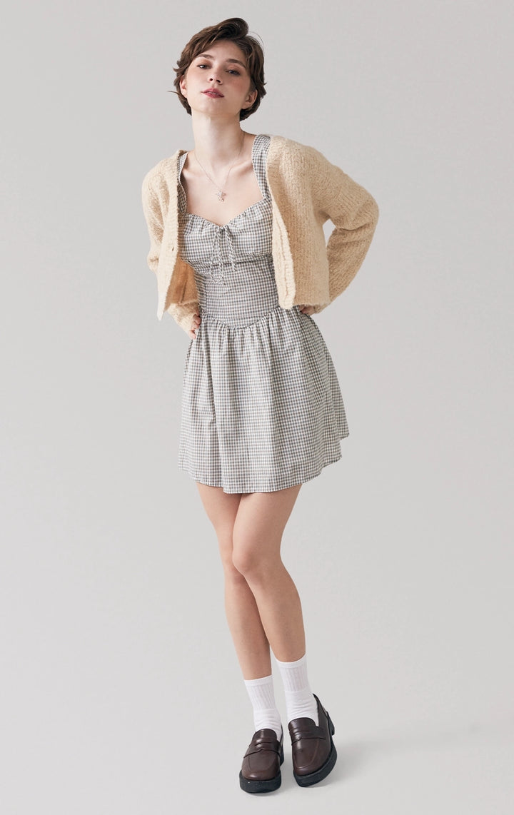 Full front view of model in beige Boucle Knit Loose Button Front Cardigan, showcasing its soft texture, V-neckline, and cropped fit from the Back to School line by Just G Philippines.