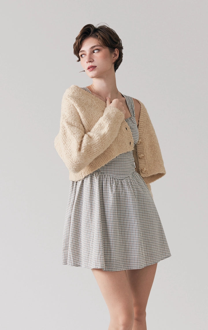 Stylized image of model in beige Boucle Knit Loose Button Front Cardigan from the Back to School line, layered for a cozy-chic vibe from Just G Philippines.