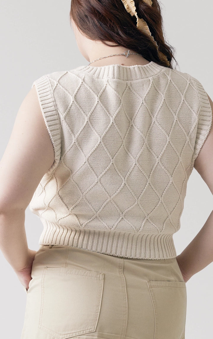 Close-up of back details of the Trellis Cable Knit Button Front Cropped Vest in beige, showing the soft combed cotton knit and subtle texture from Just G Philippines.