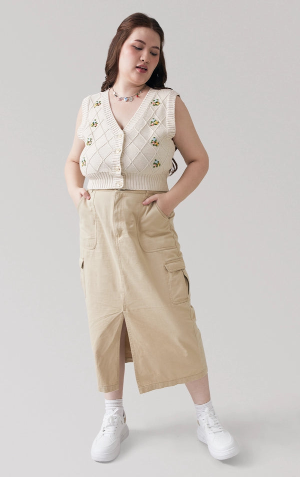 Full front view of the Trellis Cable Knit Button Front Cropped Vest in beige, showing its V-neckline and cable knit texture with floral embroidery from Just G Philippines.